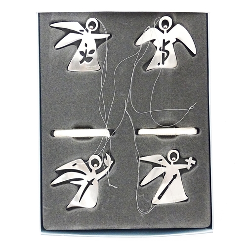 1106 - A set of four Danish Georg Jensen Christmas decorations of angel form comprising the four archangels... 