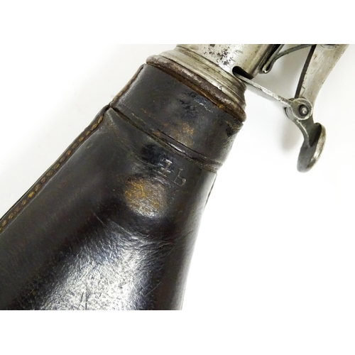 1110 - A late 19thC shot flask, the steel spout with measures for 1 and 1 1/4oz shot, the leather pouch wit... 