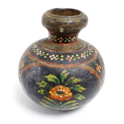 1115 - An Indian toleware vase with hand painted decoration depicting flowers and foliage. Approx. 5 1/4