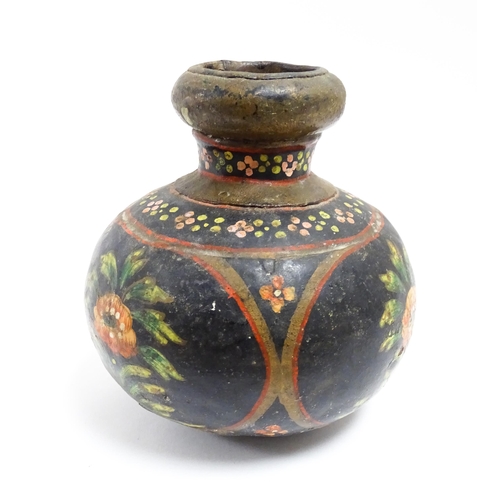 1115 - An Indian toleware vase with hand painted decoration depicting flowers and foliage. Approx. 5 1/4