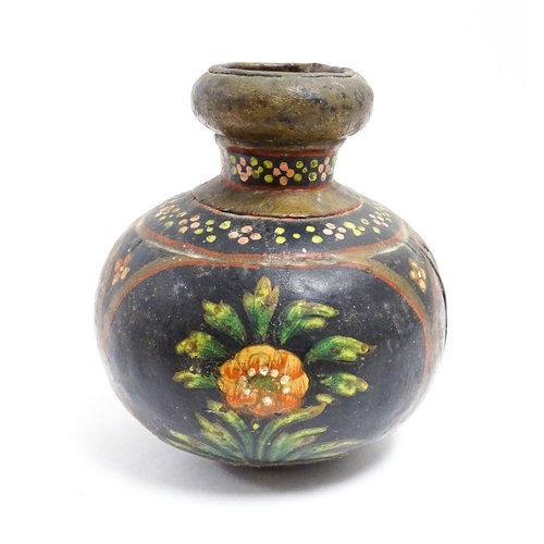 1115 - An Indian toleware vase with hand painted decoration depicting flowers and foliage. Approx. 5 1/4