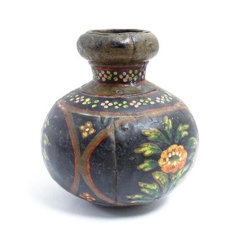 1115 - An Indian toleware vase with hand painted decoration depicting flowers and foliage. Approx. 5 1/4