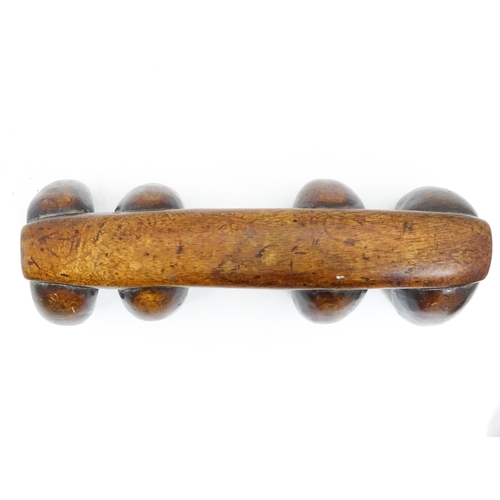 1122 - Ethnographic / Native / Tribal: A tribal carved wooden head rest with eight supports. Approx. 4 1/4