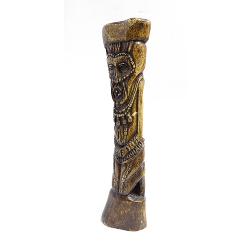 1124 - Ethnographic / Native / Tribal: An African Yoruba tribal carved water buffalo thigh bone with figura... 