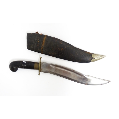 1127 - An Indian dagger / knife, the carved horn handle with inlaid detail, within leather sheath. Approx. ... 