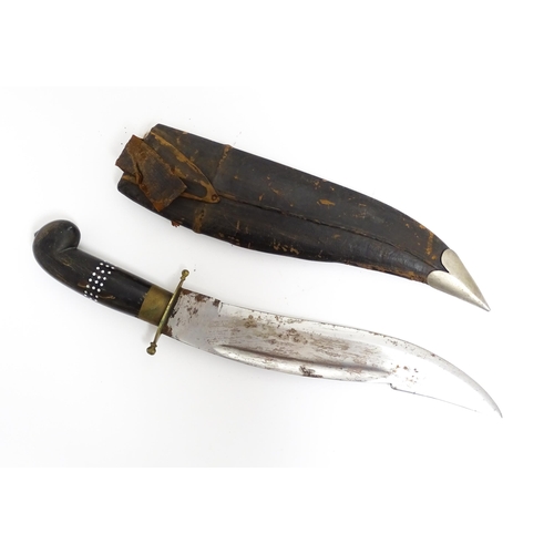 1127 - An Indian dagger / knife, the carved horn handle with inlaid detail, within leather sheath. Approx. ... 