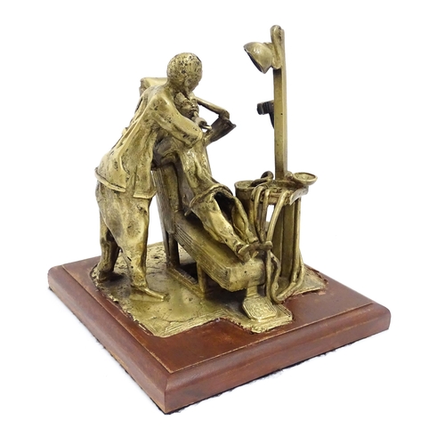 1025 - A 20thC brass sculpture depicting dentist and patient, with a wooden base. Approx. 8 3/4