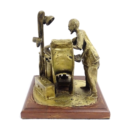 1025 - A 20thC brass sculpture depicting dentist and patient, with a wooden base. Approx. 8 3/4