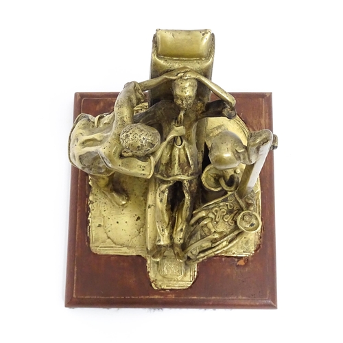 1025 - A 20thC brass sculpture depicting dentist and patient, with a wooden base. Approx. 8 3/4