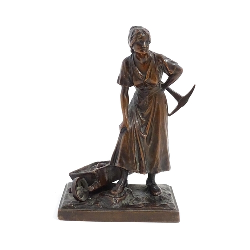 1029 - A 20thC cast sculpture depicting a female miner with an axe and a wheelbarrow of coal. Numbered 6129... 