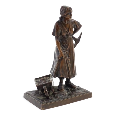 1029 - A 20thC cast sculpture depicting a female miner with an axe and a wheelbarrow of coal. Numbered 6129... 