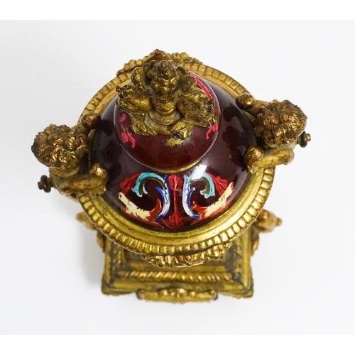 1033 - A late 19th / early 20thC single garniture of urn form with painted detail and gilt figural and dolp... 