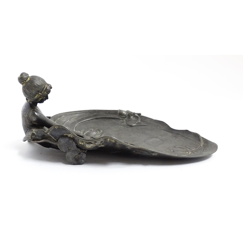 1050 - A WMF Art Nouveau figural pewter dish modelled as a maiden beside a pond with lily pads. Marked unde... 