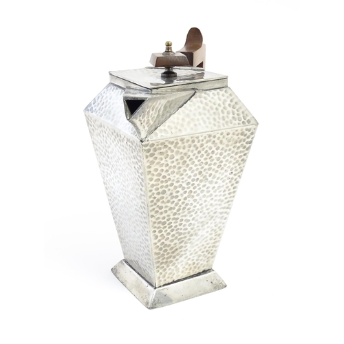 1051 - An Arts and Crafts pewter coffee pot of squared form with hammered decoration, and wooden handle and... 