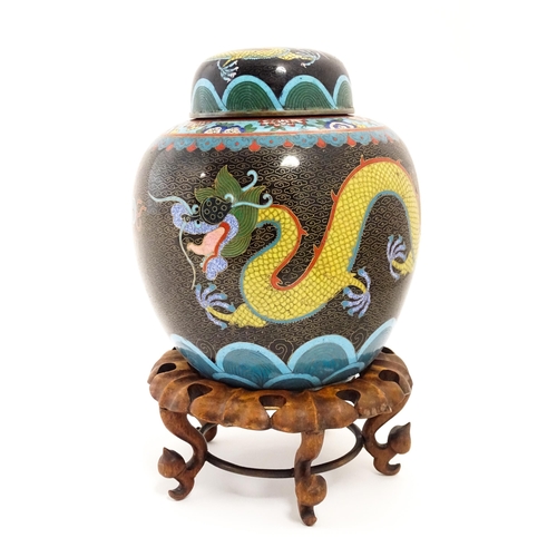 1057 - A Chinese cloisonne ginger jar with a black ground decorated with dragons and a flaming pearl. Toget... 