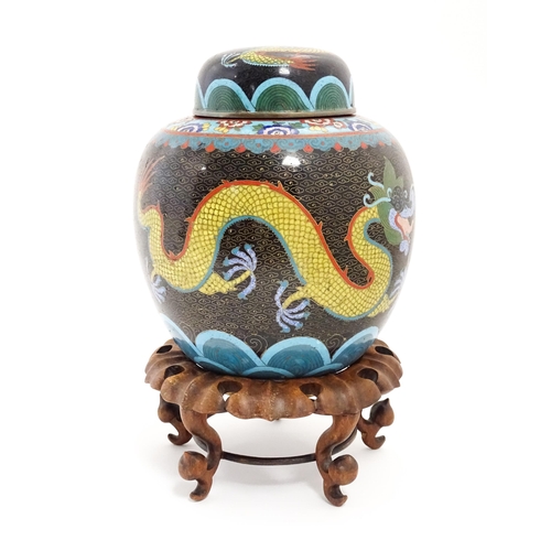 1057 - A Chinese cloisonne ginger jar with a black ground decorated with dragons and a flaming pearl. Toget... 