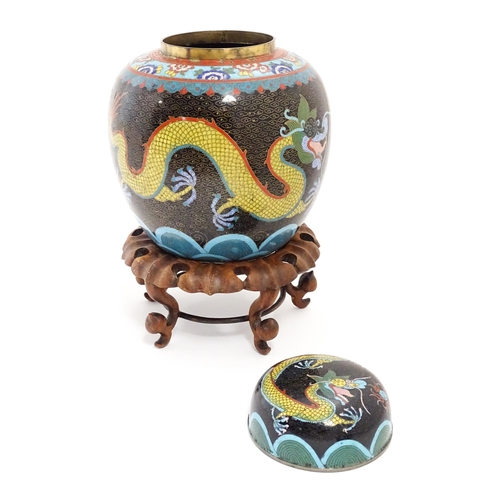 1057 - A Chinese cloisonne ginger jar with a black ground decorated with dragons and a flaming pearl. Toget... 