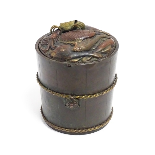 1060 - A Japanese bronze novelty inkwell of cylindrical form, the lid with fish and crab detail, the body w... 