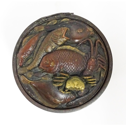 1060 - A Japanese bronze novelty inkwell of cylindrical form, the lid with fish and crab detail, the body w... 