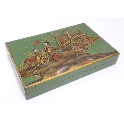 1068 - A 20thC cigarette box with chinoiserie decoration depicting two figures in a landscape with pagoda s... 