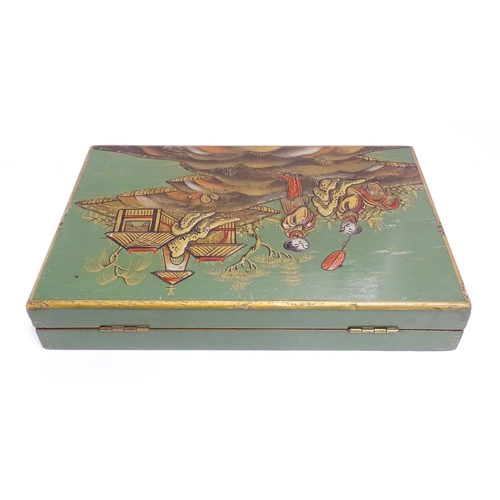 1068 - A 20thC cigarette box with chinoiserie decoration depicting two figures in a landscape with pagoda s... 