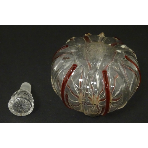 240 - An early 20thC glass scent / perfume bottle with red glass detail and silver collar hallmarked Birmi... 