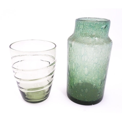 250 - Three items of glassware to include a trailed green glass vase, a green soda glass jar / vase, and a... 