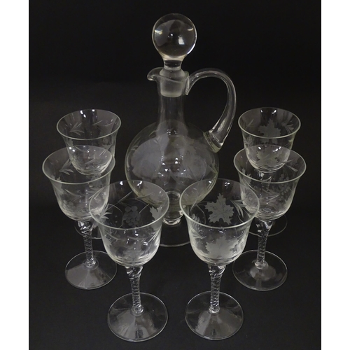 252 - A 20thC glass decanter with etched fruiting detail. Together with six matching drinking glasses. Dec... 