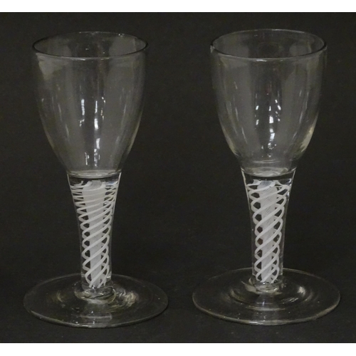 257 - Two 18th / 19thC pedestal drinking glasses with twist detail to stems. Approx. 5