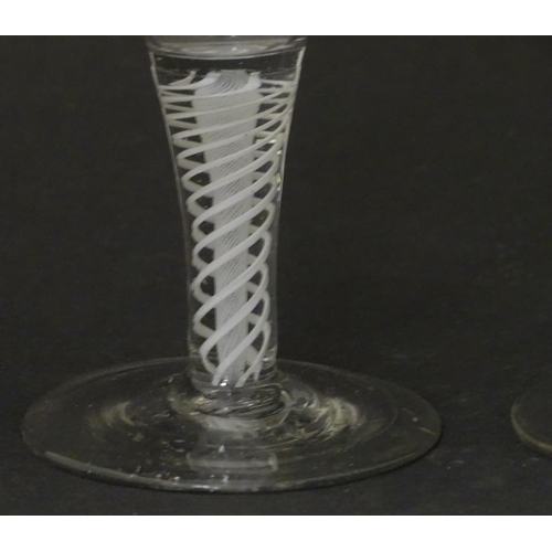 257 - Two 18th / 19thC pedestal drinking glasses with twist detail to stems. Approx. 5