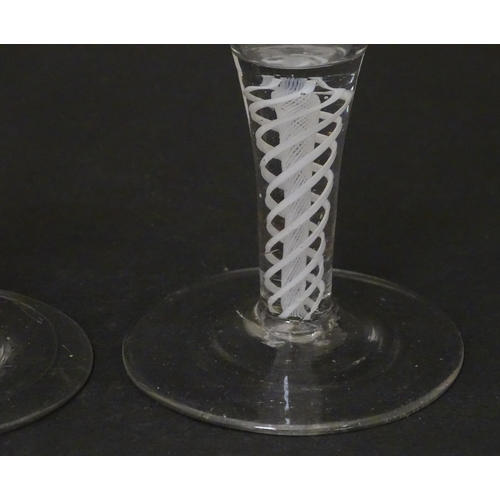 257 - Two 18th / 19thC pedestal drinking glasses with twist detail to stems. Approx. 5