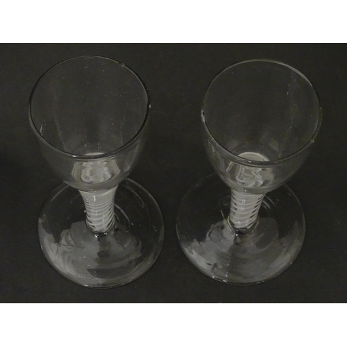 257 - Two 18th / 19thC pedestal drinking glasses with twist detail to stems. Approx. 5