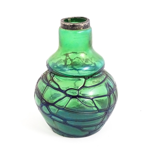 258 - An Art Nouveau green art glass vase with blue iridescent trail detail with silver rim, hallmarked Bi... 