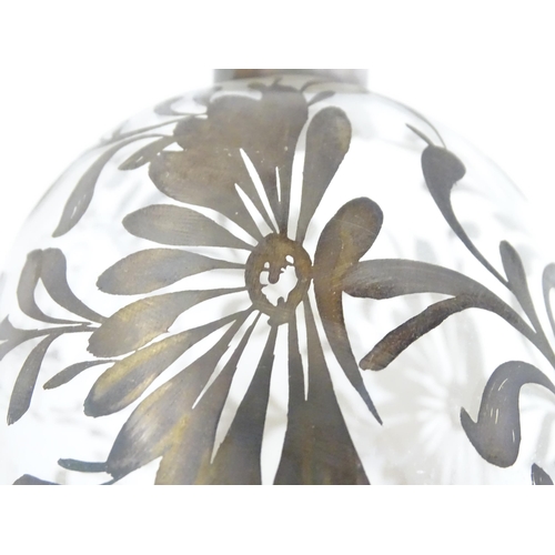 259 - A Schnapps decanter together with four glasses with lustre detail. The decanter 9