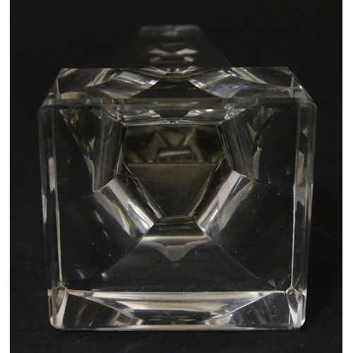 262 - A 19thC cut glass obelisk / prism with urn detail to centre. Approx. 6 3/4