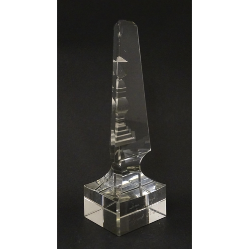 262 - A 19thC cut glass obelisk / prism with urn detail to centre. Approx. 6 3/4