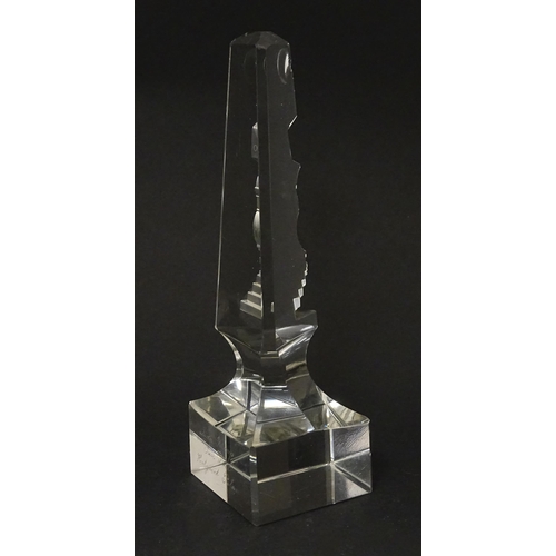 262 - A 19thC cut glass obelisk / prism with urn detail to centre. Approx. 6 3/4