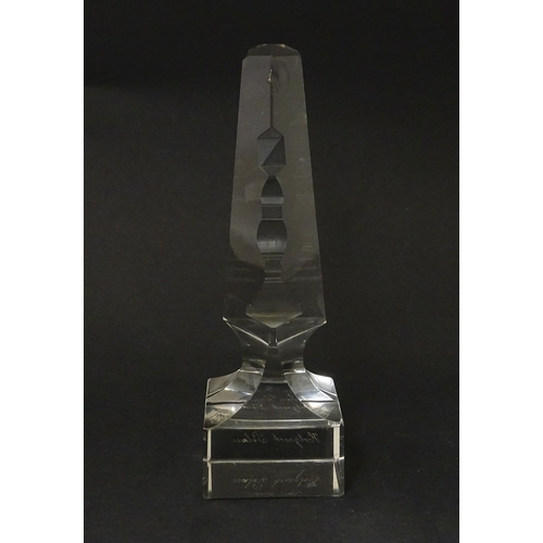 262 - A 19thC cut glass obelisk / prism with urn detail to centre. Approx. 6 3/4