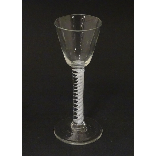 267 - An 18thC wine glass with multi-ply corkscrew twist stem. Approx. 6