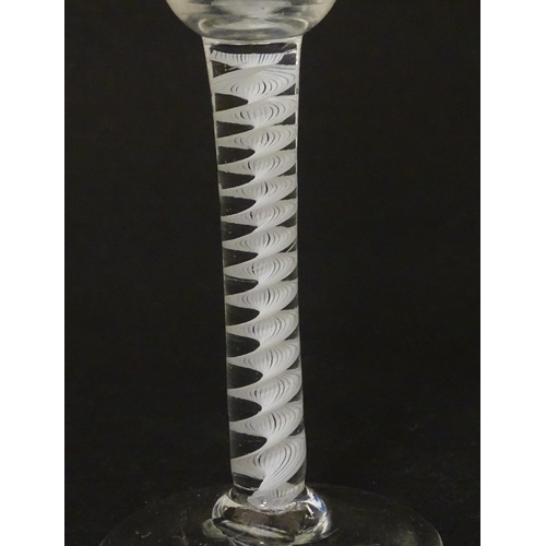 267 - An 18thC wine glass with multi-ply corkscrew twist stem. Approx. 6