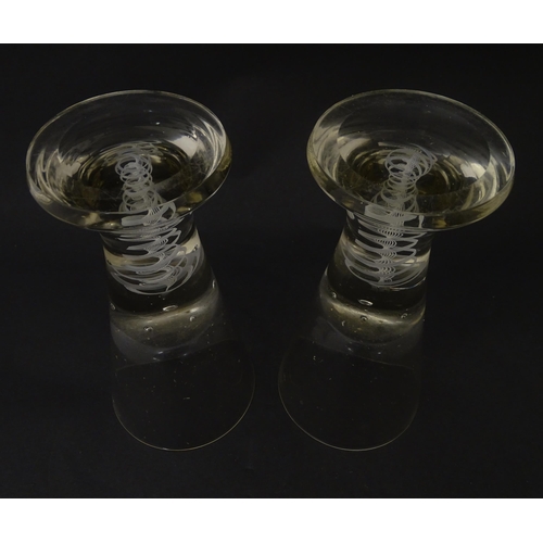 278 - A pair of drinking glasses with twist and bubble detail to stems. Approx. 7 3/4