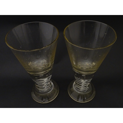 278 - A pair of drinking glasses with twist and bubble detail to stems. Approx. 7 3/4