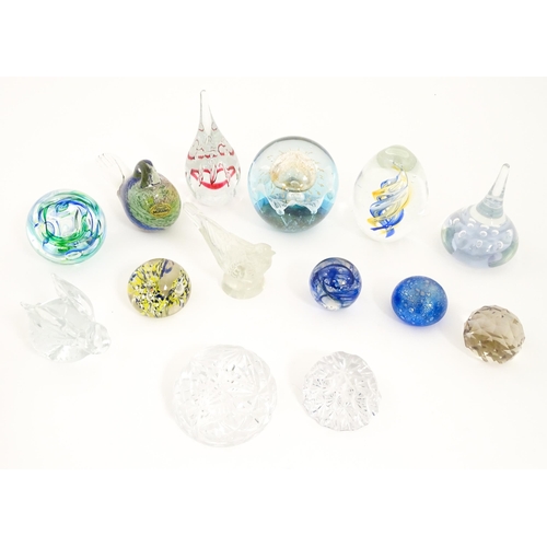 284 - A quantity of assorted glass paperweights etc. to include a Murano example formed as a bird etc. Lar... 