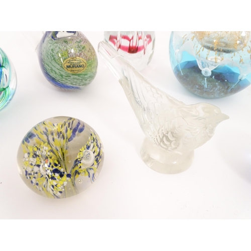 284 - A quantity of assorted glass paperweights etc. to include a Murano example formed as a bird etc. Lar... 