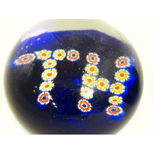 289 - Five assorted glass paperweights to include a Liskeard Glass example dated 1979, etc. Largest approx... 