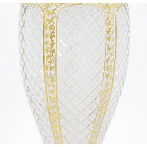 298 - A Victorian Bohemian diamond cut glass vase of pedestal tulip form with white and gilt detail. Appro... 