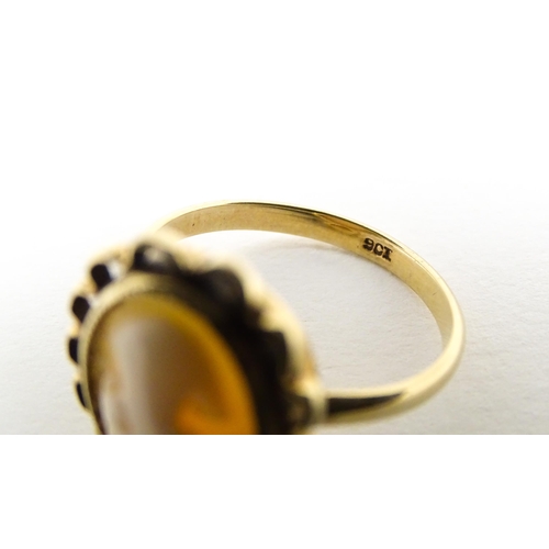 591 - A 9ct gold ring set with central cameo. Ring size approx. M