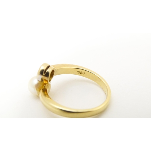 607 - An 18ct gold ring set with diamond and pearl Ring size approx. L 1/2