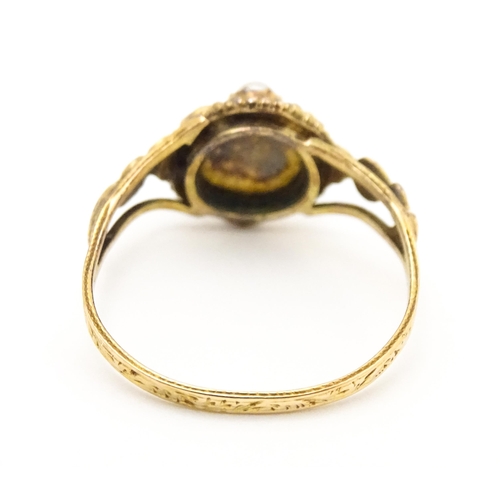 619 - A Victorian gold ring set with emeralds and pearls. Ring size approx. O