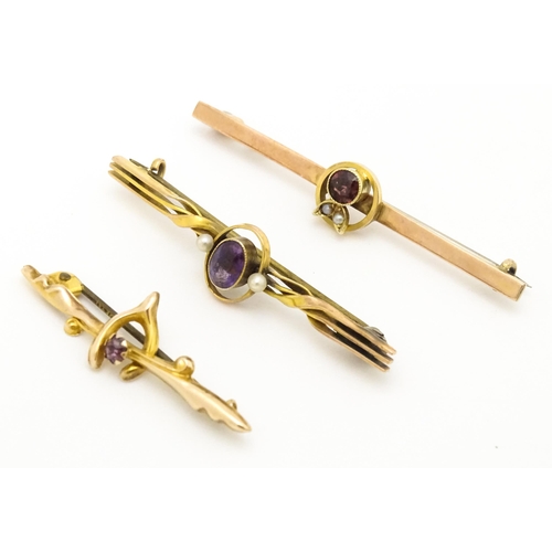 676 - Three 9ct gold bar brooches two set with amethyst and one set with garnet. The largest 2